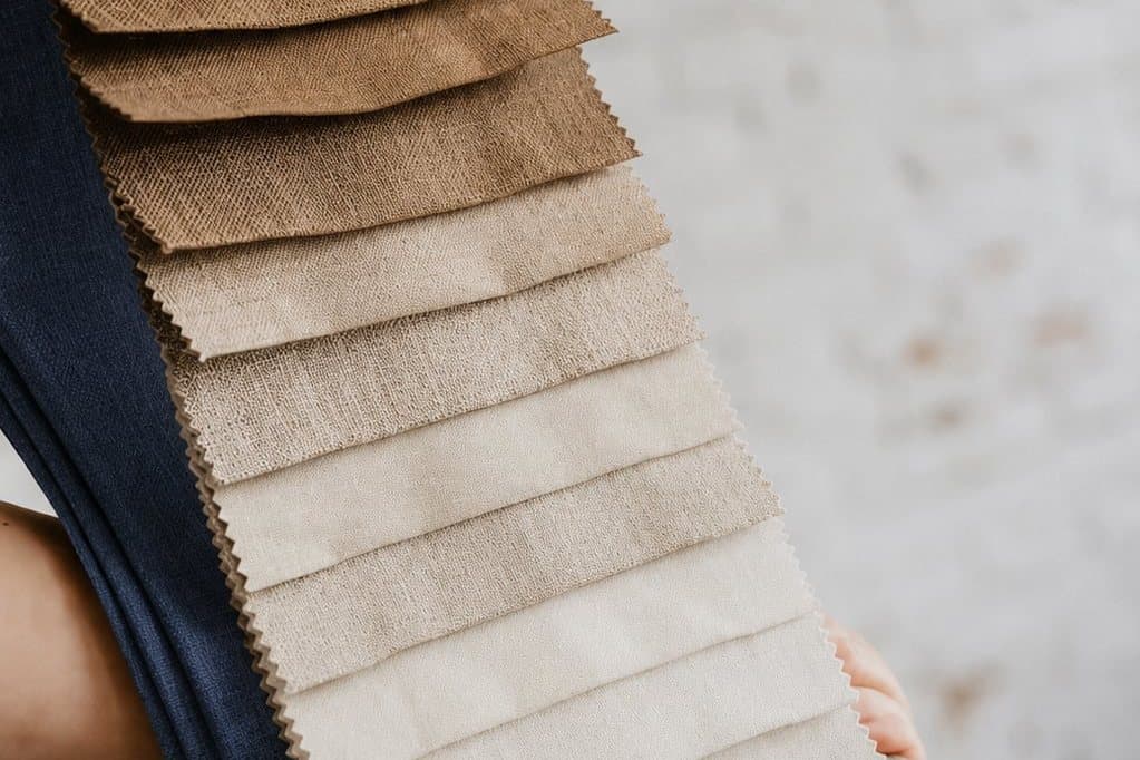 Leafing through a fabric sample book